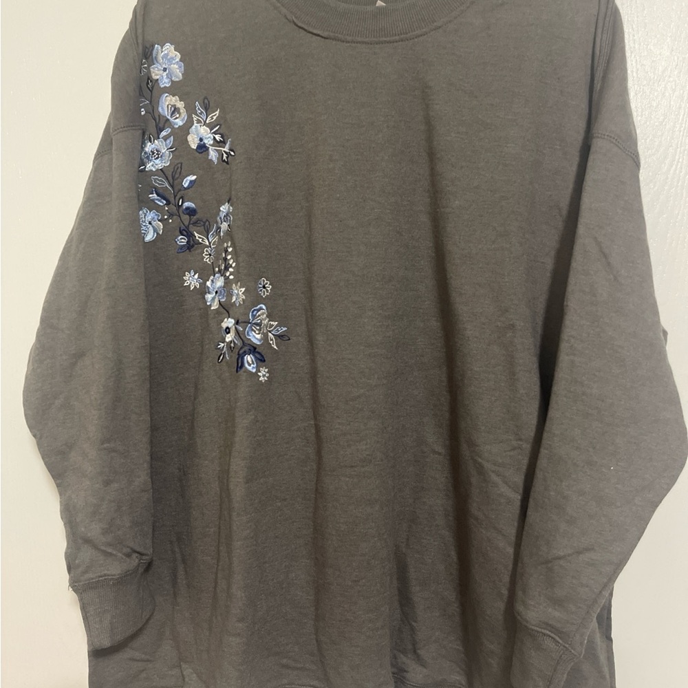 Woman Within Gray Sweater with Blue Floral Embroidery